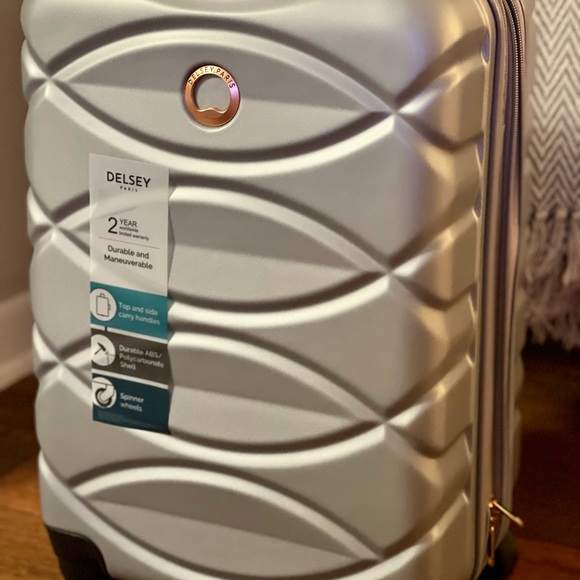 Delsey Bags Silver Carry On Luggage Poshmark